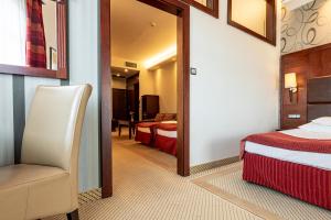 Posteľ alebo postele v izbe v ubytovaní Hotel Galicja Superior Wellness & Spa