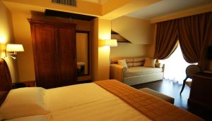 Letto o letti in una camera di Bram Hotel