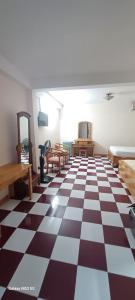 a room with a black and white checkered floor at Nhật Bình 2 in Ho Chi Minh City +6 photos