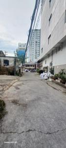 an empty parking lot in front of a building at Nhật Bình 2 in Ho Chi Minh City