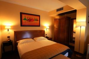 Letto o letti in una camera di Bram Hotel