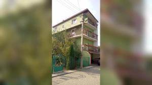 a building with balconies on the side of a street at Coffee Hostel in Lviv
