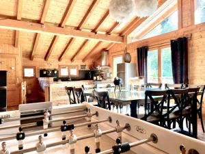 a kitchen and dining room with a table and chairs at Chalet 4C in Les Houches +47 photos