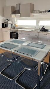 a kitchen with a table with pans on it at 2 BR apartment next to metro U1 and Garage parking in Vienna