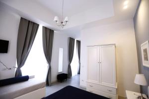 A bed or beds in a room at Rome Together Guest House