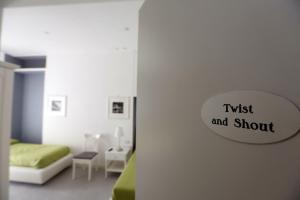 A bed or beds in a room at Rome Together Guest House