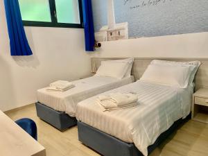 Postel nebo postele na pokoji v ubytování LOASI room&relax