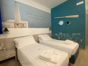 Postel nebo postele na pokoji v ubytování LOASI room&relax