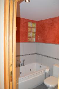 a bathroom with a tub and a toilet at Barraca Beach in Valencia +10 photos