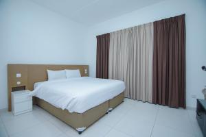 Ένα ή περισσότερα κρεβάτια σε δωμάτιο στο Home Away Holiday Homes