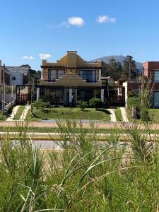 a large house in the middle of a city at Medanos del Portal in Piriápolis