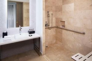 a bathroom with a sink and a shower at Hyatt Regency Grand Reserve Puerto Rico in Rio Grande
