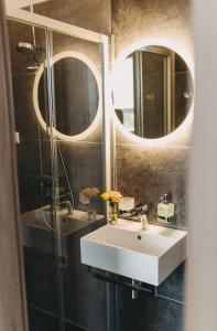 Koupelna v ubytování Hotel am Stadtpark Nordhausen + 33 fotografií