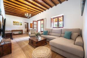 a living room with a couch and a table at Can Torres in Santa Eularia des Riu