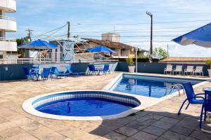 Bazén v ubytování Confortável Flat Na Praia nebo v jeho okolí