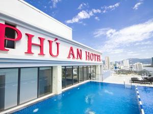 a hotel with a swimming pool on top of a building at Phú An Hotel in Da Nang
