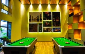 a billiard room with two pool tables at Studio Flat Near Airport in Surat