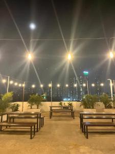 a group of benches with a city in the background at The Embassy Suites in Hyderabad