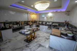 a kitchen with a counter with food on it at Jordan Seasons Hotel in Aqaba