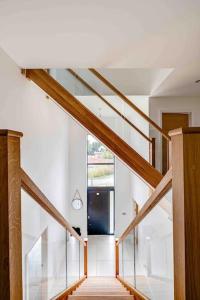 a staircase in a house with a glass ceiling at Lovely spacious home in Cheshire in Willaston