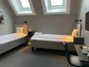Postel nebo postele na pokoji v ubytování Unique Hotel Jungfrugatan