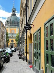 a street with a building with a domed building at Unique Hotel Jungfrugatan in Stockholm