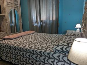Posteľ alebo postele v izbe v ubytovaní L'ermellino Ubriaco Casa vacanza + 10 fotografií
