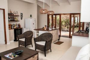 a kitchen with a table and chairs in a room at The View @ Santa Maria in Santa Maria