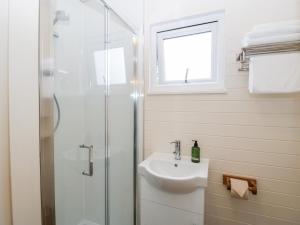 a bathroom with a sink and a shower at Willow in Kemble