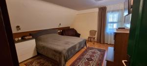 מיטה או מיטות בחדר ב-Planinski Dom na Travni Gori