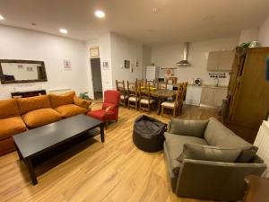 a living room with a couch and a table at El Mirador del Chorrillo in Olmeda de las Fuentes