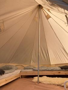 a tent with two bunk beds in it at Jardim Dos Mil Gostos Covões in Sertã