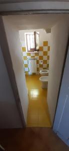 a bathroom with two toilets and a window at Nicolas House in Campiglia dʼOrcia +75 photos