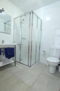 a bathroom with a shower and a toilet at Apartamentos Arena Dorada in Puerto del Carmen