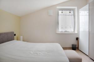 A bed or beds in a room at Nigella Langhe Home