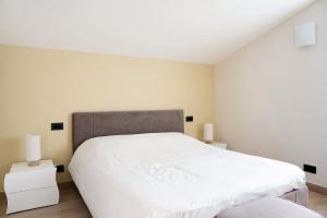 A bed or beds in a room at Nigella Langhe Home