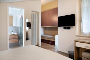 A bed or beds in a room at Nigella Langhe Home