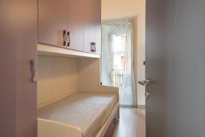 A bed or beds in a room at Nigella Langhe Home