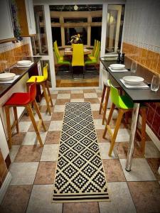 a kitchen with a table and chairs and a dining room at 6 bedroom house - Pool table - Contractors - Crew in Colchester