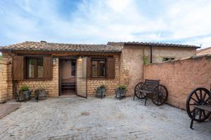 a brick house with a bench in front of it at Casa Rural Adolfo in Santa Inés