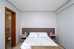 Ένα ή περισσότερα κρεβάτια σε δωμάτιο στο Onix Bueno Residence - ONX