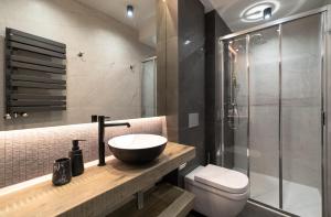 a bathroom with a sink and a toilet and a shower at Brylant Szczyrku - Apartament Kalinowa 23 blisko centrum - Dream Apart in Szczyrk +24 photos