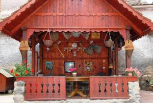 a smallshed with a table in the front of it at Pension Ela in Sibiu