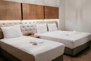 Postel nebo postele na pokoji v ubytování Ceneviz Suit Hotel