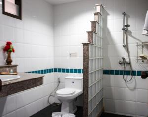 a bathroom with a toilet and a sink at Deng's kamala beach Guesthouse in Kamala Beach