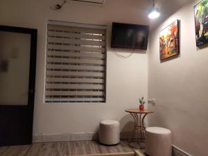 TV a/nebo společenská místnost v ubytování Da Tree Homestay