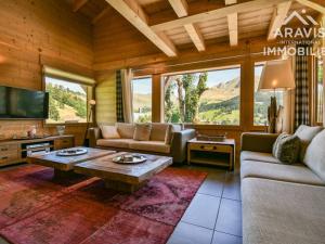 a living room with a couch and a coffee table at Chalet Le Grand-Bornand, 5 pièces, 8 personnes - FR-1-391-8 in Le Grand-Bornand