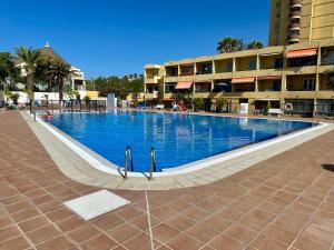a swimming pool in the middle of a building at Las Vistas Beach Los Cristianos 2 Swimming Pools in Los Cristianos