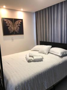 En eller flere senge i et værelse på Lindo Flat Central - Home Business
