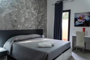 Postel nebo postele na pokoji v ubytování Mg Palace Hotel Costa del Sole + 33 fotografií